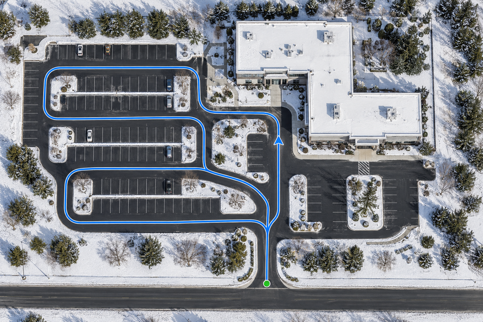 Illustrative aerial view of a fictional snow-covered commercial property, with a blue plow route through the parking aisles